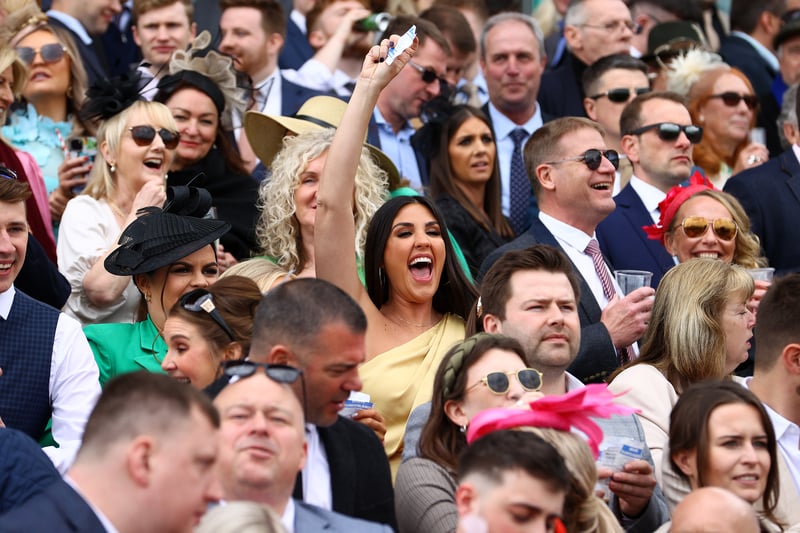 A happy racegoer is all smiles after backing a winner on day three of the Aintree Festival at Aintree Racecourse in Liverpool.