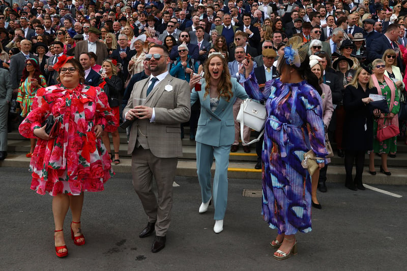 Racegoers look on during Grand National Day on day three of the Aintree Festival. 