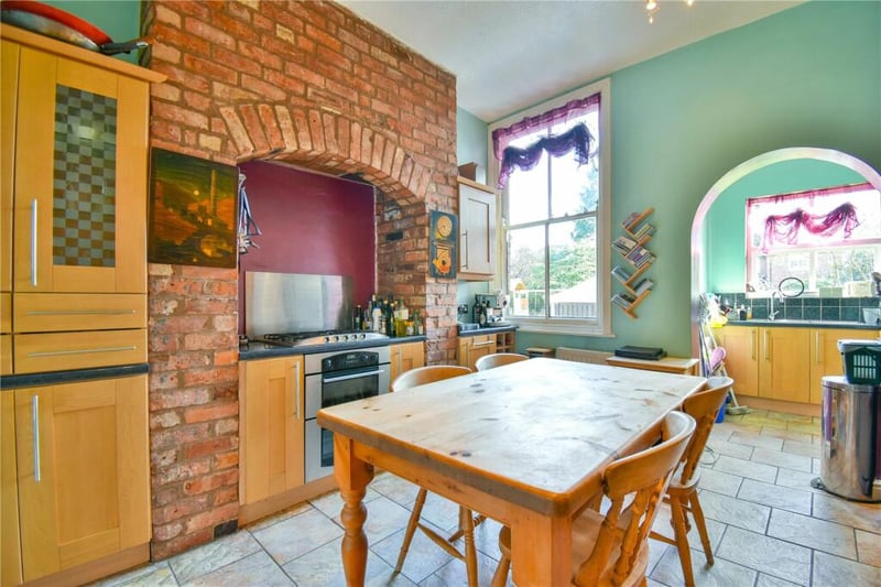 Kitchen with brick wall