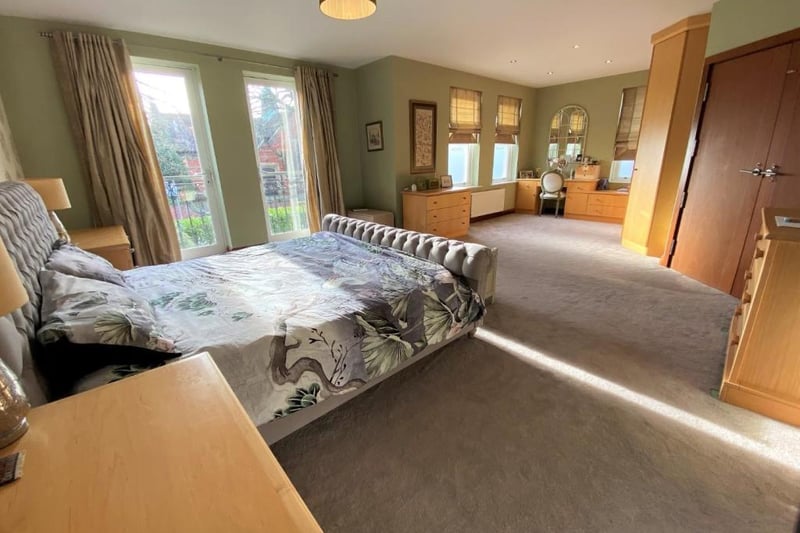 Large bedroom with fitted furniture