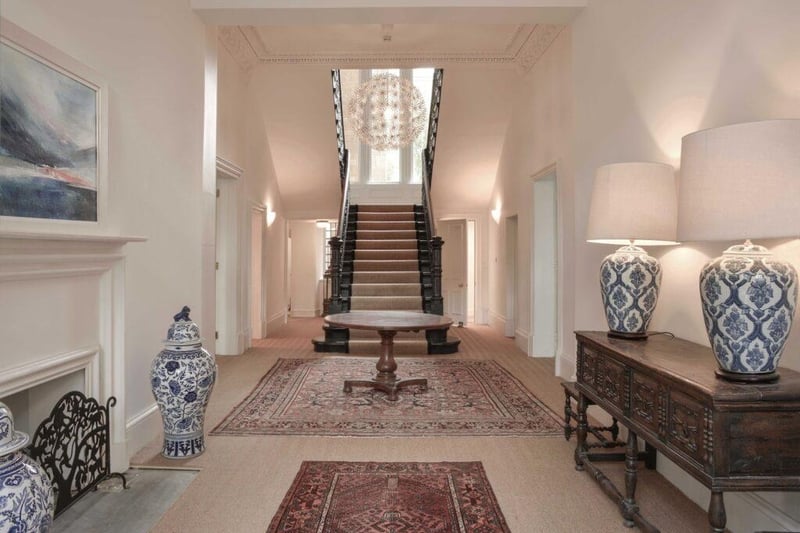 The imposing reception hallway with central double staircase. 