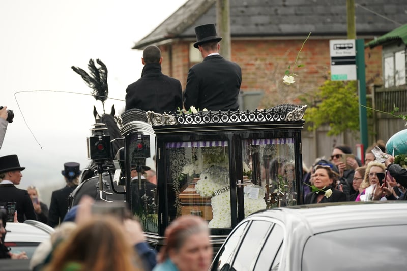 The funeral cortege of Paul O'Grady travels through the village of Aldington, Kent