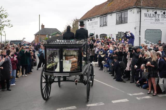 The funeral cortege of Paul O'Grady travels through the village of Aldington, Kent ahead of his funeral at St Rumwold's Church. 