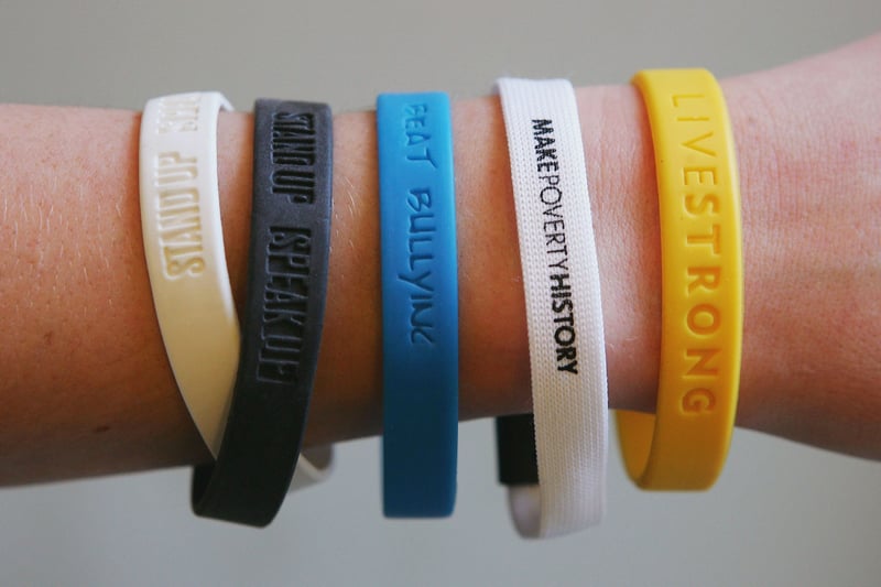 In the 00s, charity wristbands were all the rage. From the double stand up, speak up bands to the yellow livestrong bands, they were everywhere at the start of the 21st century. If you went to school in that time, you probably had a wristband or two! 