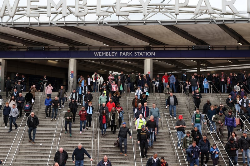 The blue shirts and scarves of City supporters can be seen as fans arrive at Wembley Park tube station before the match. Photo: Getty Images