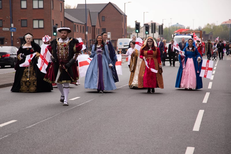 Parade participants dressed as King Henry VIII and his six wives. Photo: Tony Gribben