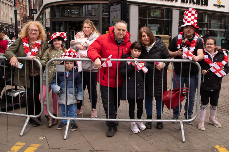 Spectators in Manchester city centre dressed in red and white to watch the parade go by. Photo: Tony Gribben