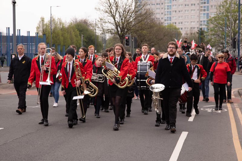 Marchers were serenaded along the route by a soundtrack from brass and pipe bands. Photo: Tony Gribben