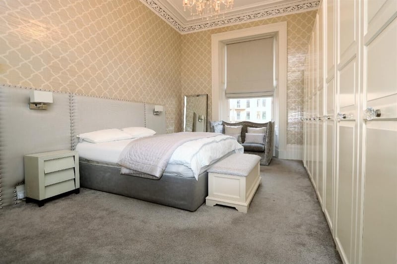 A further large bedroom in the property which contains fitted wardrobes. 