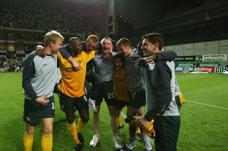 Celtic players celebrate after the whistle at the Bessa Stadium in Porto. 