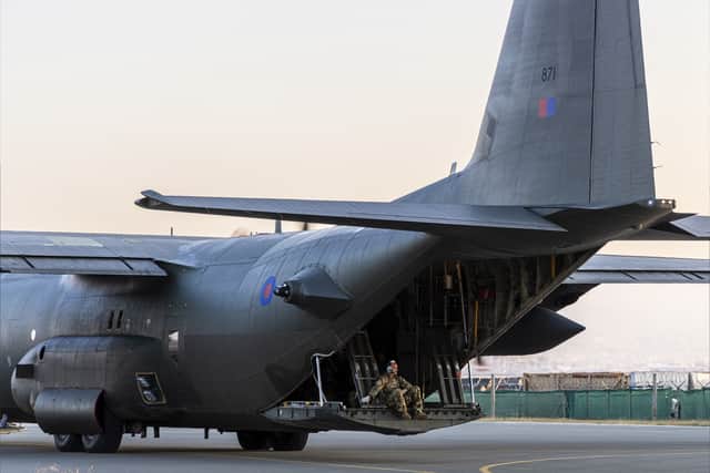 Ministry of Defence handout photo of the aircrew sitting on the tailgate of the C-130 bound for Sudan in support of the FCDO Non-Combatant Evacuate Operation. Credit: PA