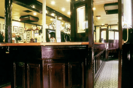 The Railway Tavern in Shettleston is an old single-storey pub with possibly the most intact Glasgow-style island bar interior. It has one of the few remaining family departments (off-sales) in the city and two small sitting rooms.
