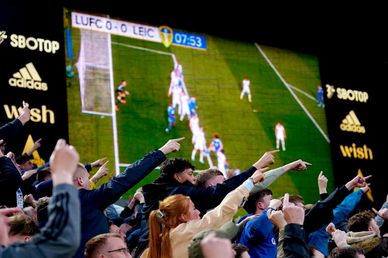 Fans react as a replay is shown on the big screen after Leicester City’s Youri Tielemans has a goal ruled out