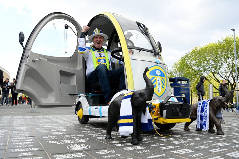 A fan shows their support while driving a Leeds United branded mobility scooter 