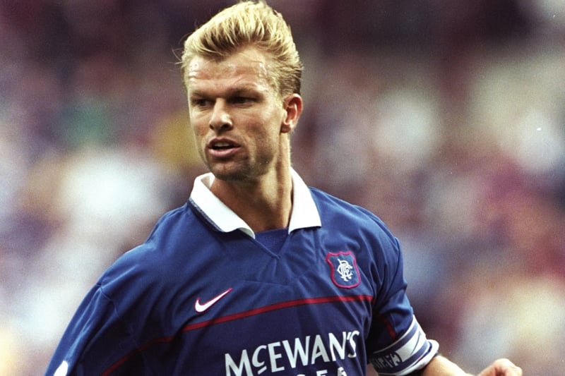 ChatGPT explanation: A Dutch left-back known for his solid defending and attacking ability, Numan was a key player for Rangers in the late 1990s and early 2000s, helping the team win several league titles.
