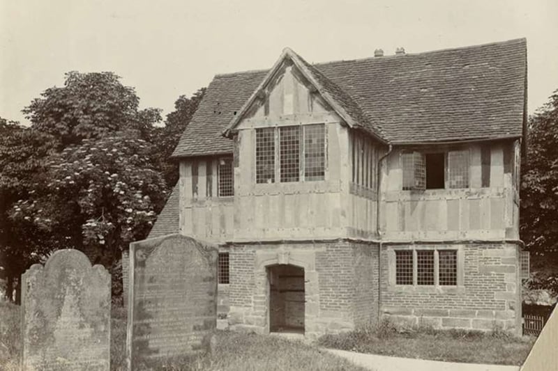 The school is said to have been built, possibly as early as 1434, as the priest’s house to the Church of St Nicholas. In 1909, two women broke into the school with the intention of burning it down in a protest for the cause of women’s suffrage. Instead, they were said to have left the message “Two Suffragists have entered here, but charmed with this old-world room, have refrained from their design of destruction.” on the blackboard.