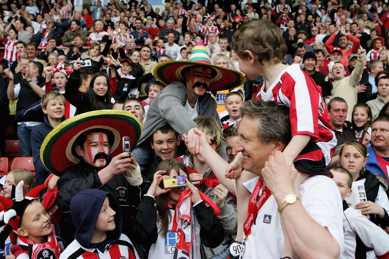 Neil Warnock of Sheffield United meets the United fans during the Coca Cola Championship match against Crystal Palace at Bramall Lane in April 2006  (Photo by Jamie McDonald/Getty Images)
