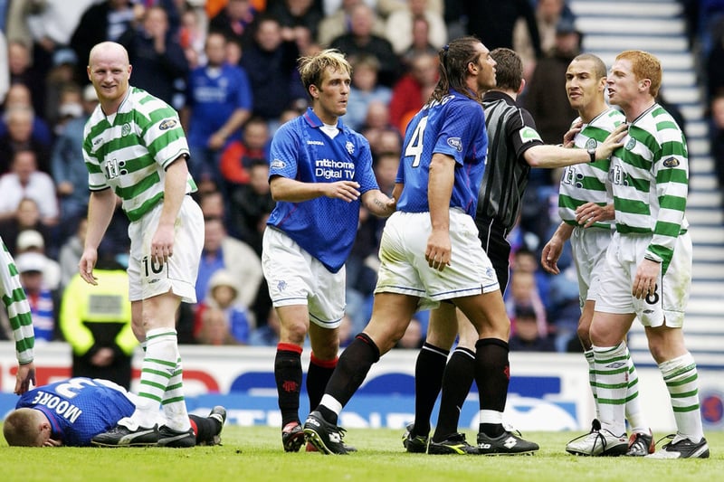 Tempers flare up between Lorenzo Amoruso and Neil Lennon during the SPL match. 