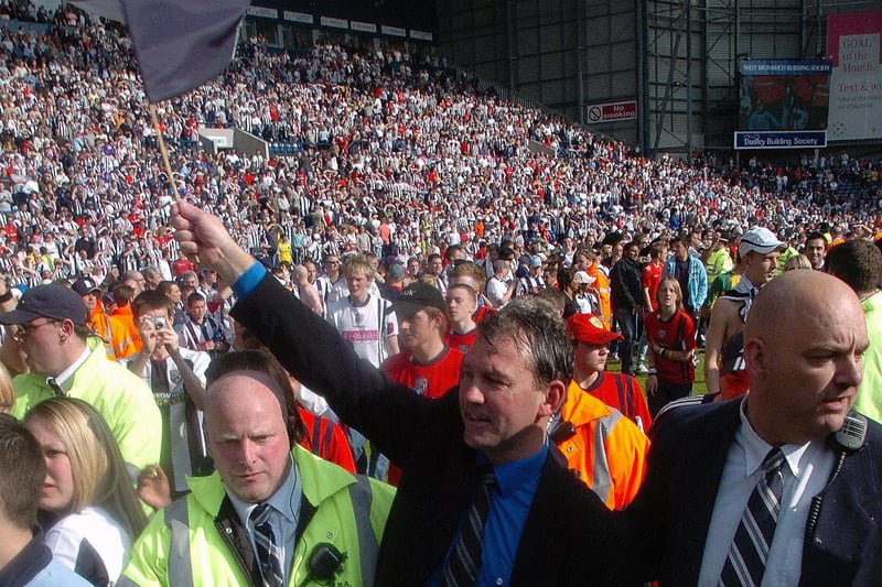 Albion boss Bryan Robson celebrates with the fans at full-time after guiding the club to safety in the most dramatic fashion on the final day