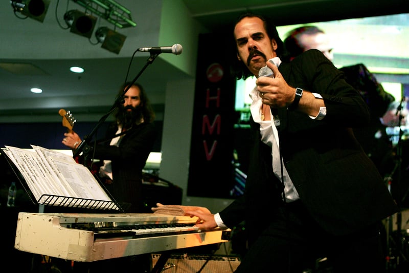 Warren Ellis and Nick Cave performed with Grinderman during the launch event for the MOJO Honours List in 2007 at HMV.  (Photo by Claire Greenway/Getty Images) 