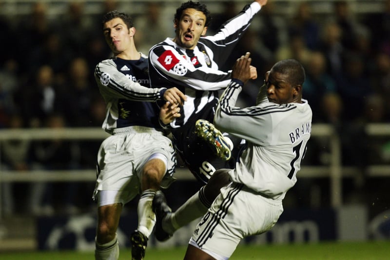 Gianluca Zambrotta of Juventus gets in a shot in between Aaron Hughes (left) and Titus Bramble of Newcastle during the UEFA Champions League, Group E match between Newcastle United and Juventus at St. James' Park in Newcastle on October 23, 2002. (Photo By Michael Steele/Getty Images)