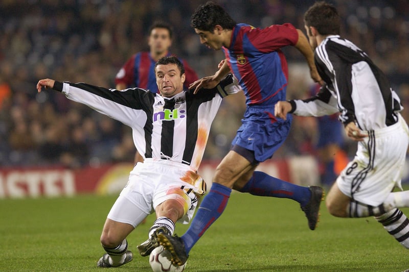  Captain Gary Speed of Newcastle United stops Juan Roman Riquelme of Barcelona during the match between Barcelona and Newcastle United in the UEFA Champions League, Second Phase, Group A match at the Nou Camp in Barcelona, Spain on December 11, 2002. (Photo By Stu Forster/Getty Images)
