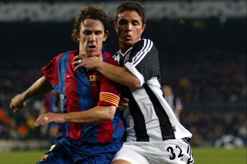  Laurent Robert of Newcastle United tussles for possession of the ball with Carles Puyol of Barcelona during the match between Barcelona and Newcastle United in the UEFA Champions League, Second Phase, Group A match held on December 11, 2002 at the Nou Camp in Barcelona, Spain.  Barcelona won the match 3-1. (Photo By Stu Forster/Getty Images)