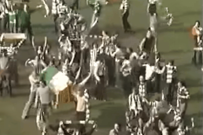 Celtic fans invaded the pitch as their team prepared to parade the trophy on the grounds.