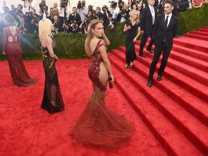 J-Lo is known for figure hugging outfits that draw attention to her curvy figure and when she attended the 2015 she wore a daring and beautiful Versace dress. It was covered in red ombre sequin and included sheer sections which highlighted her famous asset.
