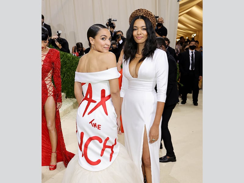 American politician and activist Alexandria Ocasio-Cortez made her debut appearance at the Met Gala in 2021 wearing a Brother Vellis white gown with “Tax the Rich” written in red across her back.