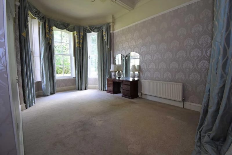 The main bedroom is extremely spacious and has big windows that let in lots of natural light