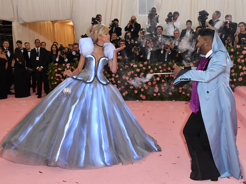 Wearing a dress fit for a princess, Zendaya attended the 2019 Met Gala in a Tommy Hilfiger blue ball gown inspired by Disney princess Cinderella. Her stylist, Law Roach, even dressed as her fairy godmother and carried a wand which, when waved, made her dress light up like a fairytale come to life.