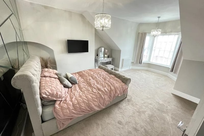 Bedroom 2 features a large area by the windows that could be perfect for a work space or cosy nook