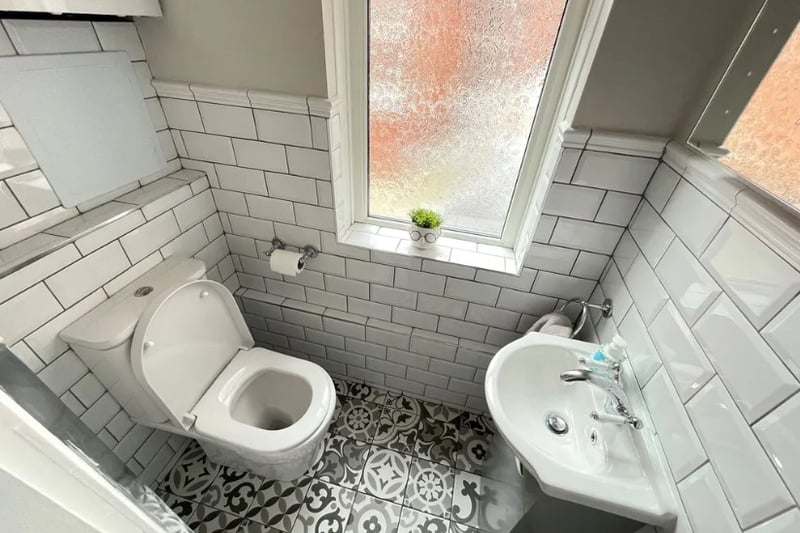 A smaller secondary bathroom is significantly smaller but has a nice modern feel