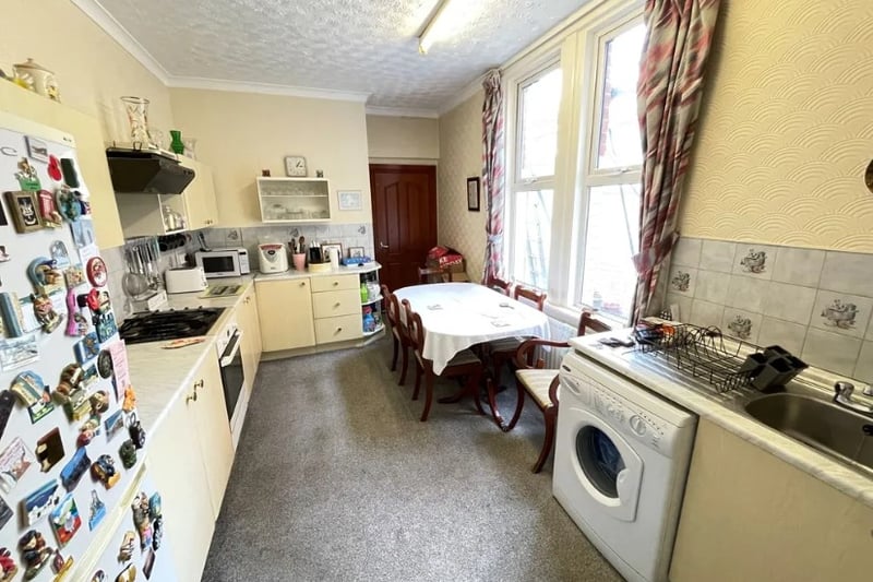 A smaller kitchen inside the granny flat has enough room for a large dining room table 