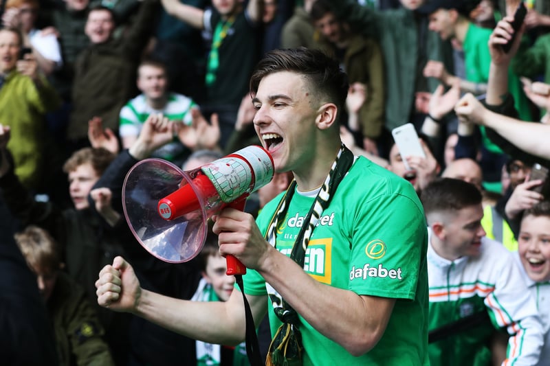 Celtic defender Kieran Tierney conducts the orchestra in celebration through a loudspeaker.