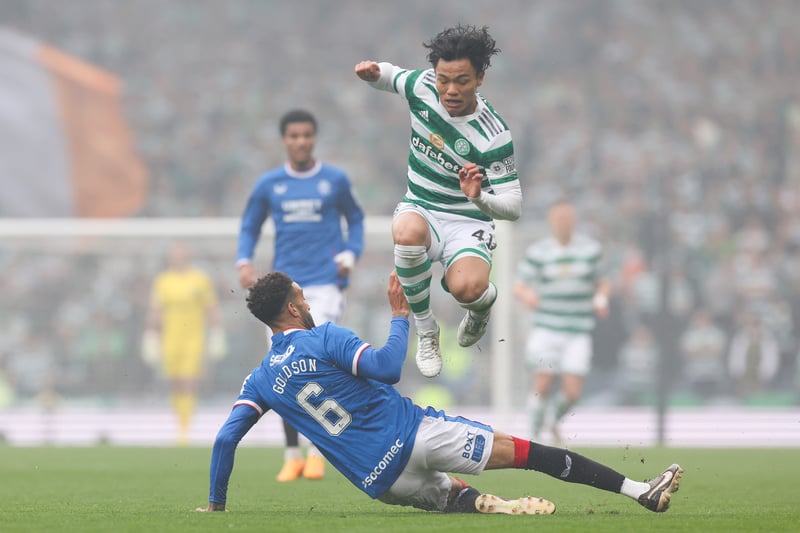 Rangers defender Connor Goldson slides in on Celtic midfielder Reo Hatate who has to jump over the Englishman after a frantic start to the derby.