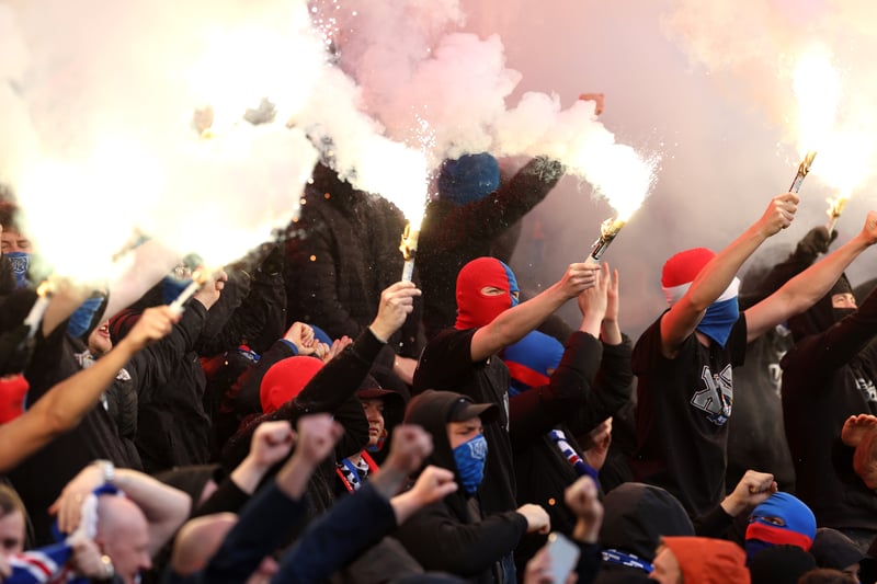 Rangers fans let off flares and smoke bombs as the two teams make their way out onto the pitch before kick-off.