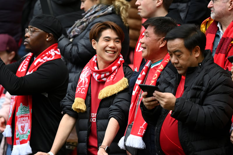 Liverpool fans smile prior to the Premier League match between Liverpool FC and Tottenham Hotspur at Anfield.