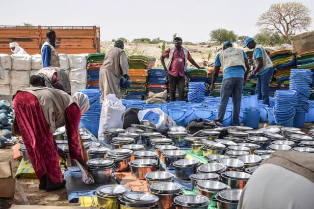Personnel form the United Nations Children's Fund (UNICEF) prepare aid kits for Sudanese refugees. Photo by GUEIPEUR DENIS SASSOU/AFP via Getty Images