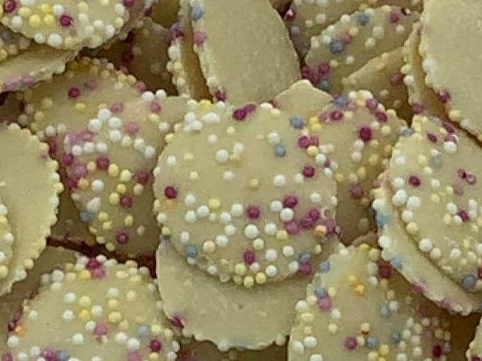 Snowies (also known as Jazzies) were a white chocolate button decorated with candy bits - what more could you want from a sweetie?