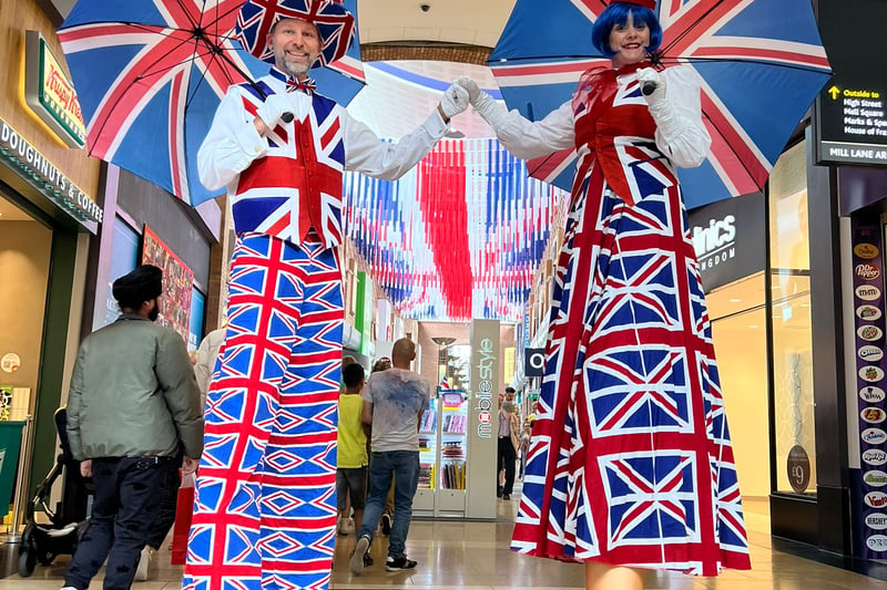 Touchwood Solihull will have a host of activities and live entertainment for families to enjoy. The centre’s union jack umbrella walkway is now open for visitors. There are 60 umbrellas suspended over Mill Lane Arcade. There will be live performances – with street entertainer ‘Elton Wrong’ roaming the mall, and face painting on offer for youngsters on Friday 5th May. On Saturday 6th May, The Core Theatre in Theatre Square will be showing a live screening of the Coronation event. Guests will feel like royalty, with the opportunity to take photos at a royal-themed selfie station located in the former Topshop unit.     On Monday 8th May, Jack & Jill stilt walkers will be walking at the centre.     Touchwood is also supporting festivities organised by the Solihull BID, with the Coronation themed family sticker trail available to collect from the Touchwood Information Desk.
