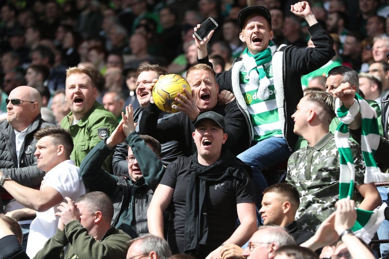 Celtic fans celebrate during the Premiership match between Hearts and Celtic at Tynecastle Stadium as Brendan Rodgers won his first title in charge of the club. 