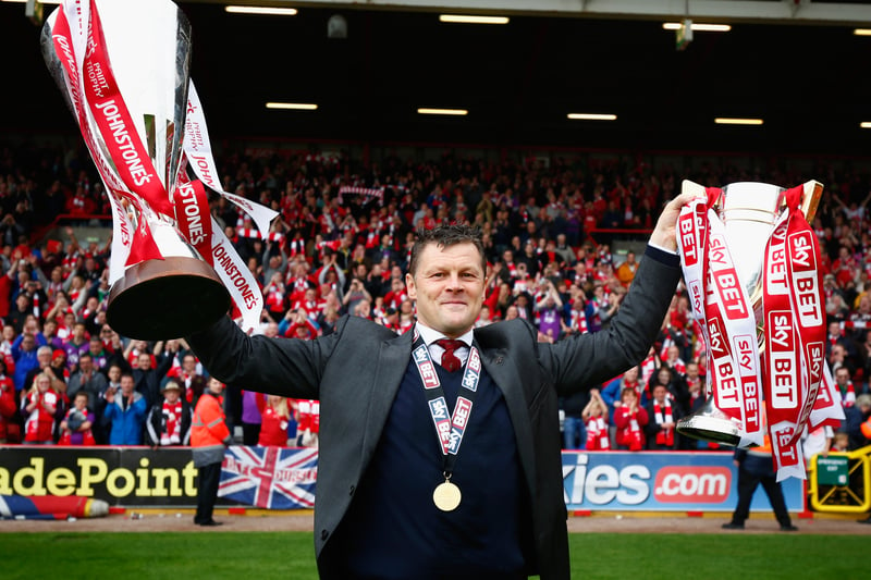 This time facing the camera. Steve Cotterill poses with the supporters. 