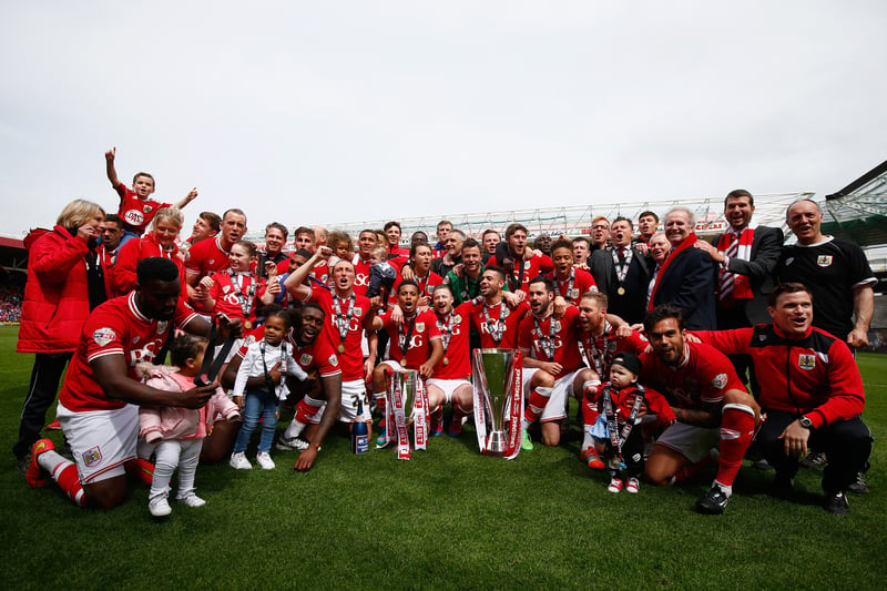 Bristol City’s squad and staff celebrate together, along with their families. 