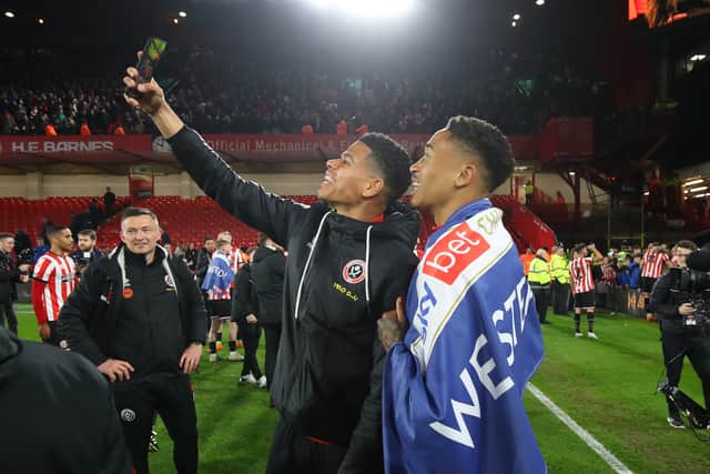 Daniel Jebbison and Will Osula grab a selfie after United’s promotion was confirmed 