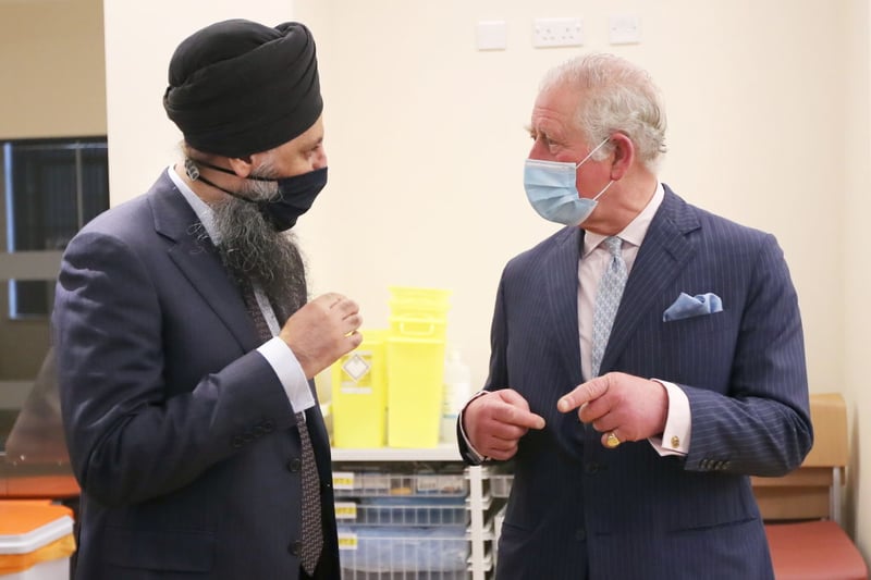 King Charles talks with Chief Pharmacist Inderjit Singh during a visit to The Queen Elizabeth Hospital on February 17, 2021 in Birmingham, England. (Photo by Molly Darlington - WPA Pool/Getty Images)