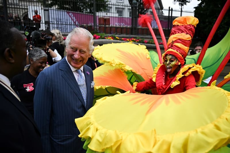 Britain’s Prince Charles, Prince of Wales reacts as he speaks with a performer during a visit to the Commonwealth Games ‘Festival Site’ at Victoria Square on the eve of the Commonwealth Games, on July 28, 2022, in Birmingham, England. (Photo by Ben Stansall - Pool/Getty Images)