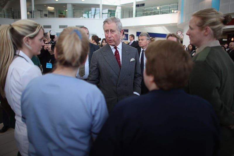 King Charles, then the Prince of Wales, talks to military and civilian staff during a visit to the Queen Elizabeth Hospital on March 9, 2011 in Birmingham, England. The Prince toured the wards and chatted to troops wounded in Afghanistan who are being cared for at the Royal Centre for Defence Medicine.  (Photo by Christopher Furlong - WPA Pool/Getty Images)