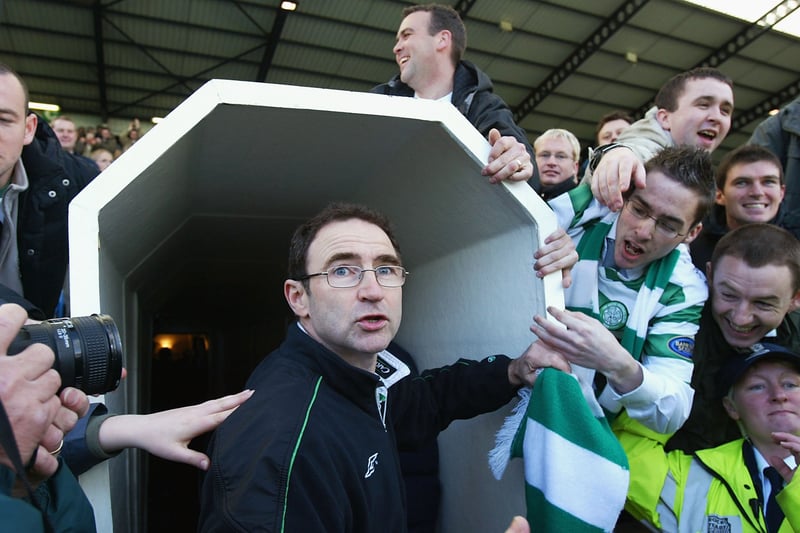 Celtic manager Martin O’Neill is mobbed by supporters at the end of the match between Kilmarnock and Celtic at Rugby Park after his side secured the league title.  